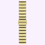 A gold metal Tissot Watches SRV 30mm T1601103311300 band, featuring a clasp engraved with TISSOT 1853, is displayed vertically against a light background—a stylish match for the refined craftsmanship and Swiss quartz solar movement of this iconic timepiece from Tissot Watches.