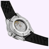 Close-up of the Tissot Watches Seastar 2000 44mm T1209071728100’s back with a black rubber strap, displaying the transparent case back that reveals the Powermatic 80 automatic movement and engraved edge details.