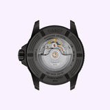 The Tissot Watches Seastar 2000 44mm T1209073704100 features a black case back with a sapphire crystal exhibition window that reveals the Swiss automatic movement, and is rated for 600m water resistance.