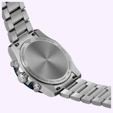 The stainless steel case back of a Tissot Watches Supersport Chrono 42mm T1254171104100 watch with a metal link bracelet, showing engraved technical details including water-resistance ratings and a sapphire crystal label.