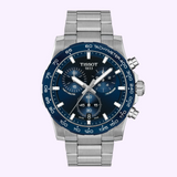 Tissot Watches Supersport Chrono 42mm T1254171104100 featuring a stainless steel link band, a blue tachymeter bezel, and a dark blue dial with three sub-dials and a date window.