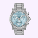 A Tissot Watches Supersport Chrono 42mm T1254171135100 wristwatch by Tissot Watches, featuring a silver case, light blue dial with three subdials, and a date window positioned at 6 o’clock, is displayed on a light purple background. This refined chronograph exemplifies Swiss craftsmanship and timeless style.