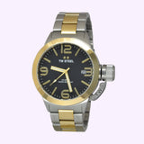 The TW Steel Watches Lexor Miami CB41 Men’s Watch features a sophisticated gold and silver metal band, a striking black dial with gold hour markers, a date display, and a prominent crown on the right side. Powered by reliable Miyota movement for precise timekeeping.