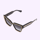 Black Valentino V-GRACE VLS-126A-54 Unisex Sunglasses in a cat-eye shape with gold-tone metal accents on the frames and temples, featuring gradient lenses.