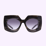 Valentino Sunglasses V - SOUL VLS-127A-53 for women by Valentino Sunglasses, featuring chunky, oversized square frames in a thick dark tortoiseshell with gradient gray lenses, set against a light lavender background—a bold Miami-inspired accessory for confident style.