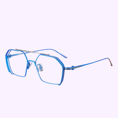 Vysen Frames The Koyv KV4 by Vysen Sunglasses are blue geometric unisex square glasses with thin titanium frames, clear lenses, and a double bridge, handcrafted in Italy. Shown on a light purple background. UPC: 3423104182972.