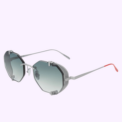Vysen Sunglasses The Sever SV3 Unisex (UPC: 3423104192209) by Vysen Sunglasses, featuring a silver octagonal frame, gradient blue-tinted lenses, mesh side shields, and thin silver arms with red tips on a light purple background.