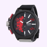 The Welder Watches 2501 K35 Oversize Chronograph from the Lexor Miami Unisex collection features a large black case, a durable black silicone strap, and a bold black and red dial with prominent red numerals at 10, 8, 2, and 4 o’clock. Accented with white markers, sub-dials, and a date display at the 9 o’clock position, this statement timepiece blends standout style with contemporary functionality.