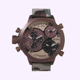 The Welder Watches K29 8005 Quartz Chronograph Unisex wristwatch, available at Lexor Miami, showcases a camouflage strap and a robust black ion-plated steel case. Featuring four dials and multiple buttons, its face combines black, beige, and purple details. This timepiece is water-resistant up to 100 meters.