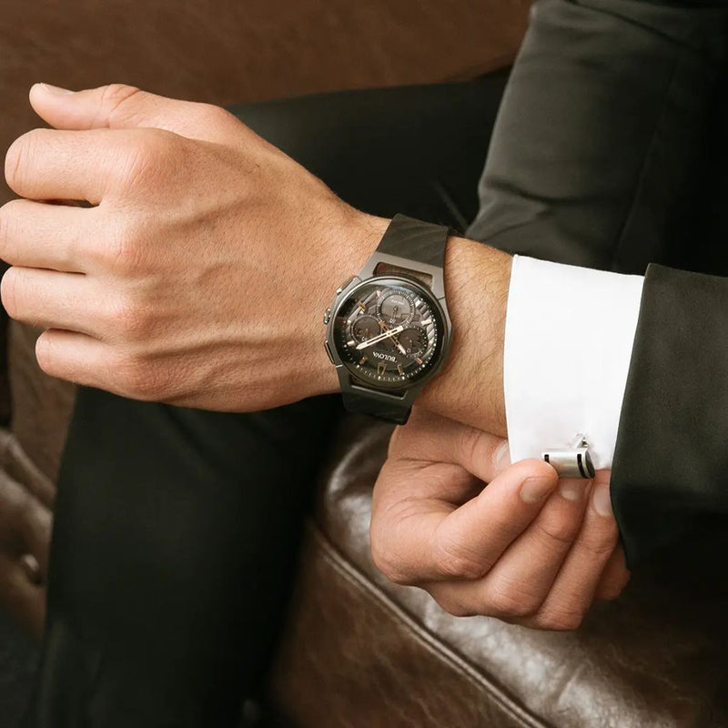 Man in a suit wearing the Bulova 98A162 CURV Chronograph with curved case and dark rubber strap