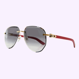 Cartier CT0440S-003 61 aviator sunglasses gold metal red wood temples grey gradient lenses