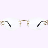 A pair of rimless Cartier Optical Frames CT0487O-001 57 by Cartier Sunglasses, featuring gold metal temples and clear lenses, is showcased from the front against a light purple background, exuding the essence of luxury eyewear.