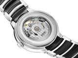 Close-up of the Rado Watches R30012152 Centrix Automatic Open Heart, showing its transparent case back, antimagnetic Nivachron hairspring, engraved automatic movement (80-hour reserve), and a stainless steel and black ceramic bracelet.