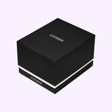 A black rectangular Citizen Watches box with white trim, featuring the Citizen Watches logo on both the top and front, displayed against a light purple background—thoughtfully designed to complement luxury timepieces like the Citizen Watches Citizen L Bianca EW5620-55A, celebrated for its cutting-edge Eco-Drive technology.