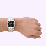A left hand displays the Diesel Watches DZ4661 men's stainless steel watch, featuring a bold black rectangular face with multiple dials, set against a plain light background. This stylish chronograph from Diesel Watches (UPC: 4064092261639) showcases the brand's signature striking design.