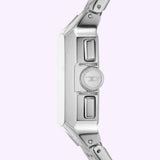 Close-up side view of the Diesel Watches DZ4661 men's chronograph watch (UPC: 4064092261639) by Diesel Watches, featuring a stainless steel case, textured crown, and two rectangular push buttons, set against a light lavender background.