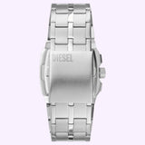 A close-up of the back of a Diesel Watches DZ4661 men's stainless steel wristwatch, featuring a metal link band and DIESEL engraved on the clasp, set against a light purple background.