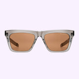 Dita Sunglasses DLS429-A-01 LSA-429 with gray square frames and brown polarized lenses, set against a pale lavender background. Reflecting exceptional Japanese craftsmanship, the partially visible temples and a subtle brand name on the upper right lens highlight the signature style of Dita Sunglasses.