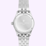 The back of a Frederique Constant Classics Index Automatic FC-530G3B6B watch in silver, featuring engraved text and a metal link band, displayed on a light purple background.