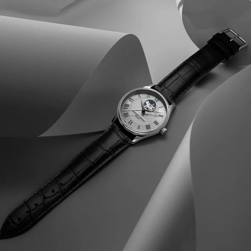 Side profile view of the Frederique Constant FC-310MC5B6 polished stainless steel case and black leather strap