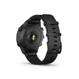 Back view of the Garmin Watches MARQ® Commander (Gen 2) Carbon Edition 010-02722-00 with a textured dark fabric strap, showing the heart rate sensor on the underside of the casing.