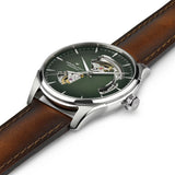 Introducing the Hamilton Watches Jazzmaster Open Heart Auto H32675560 by Hamilton Watches—a men’s luxury timepiece featuring a rich brown leather strap, an elegant green dial accented with silver markers, and intricate cutouts on the watch face that reveal the precision of its Swiss automatic mechanical movement.