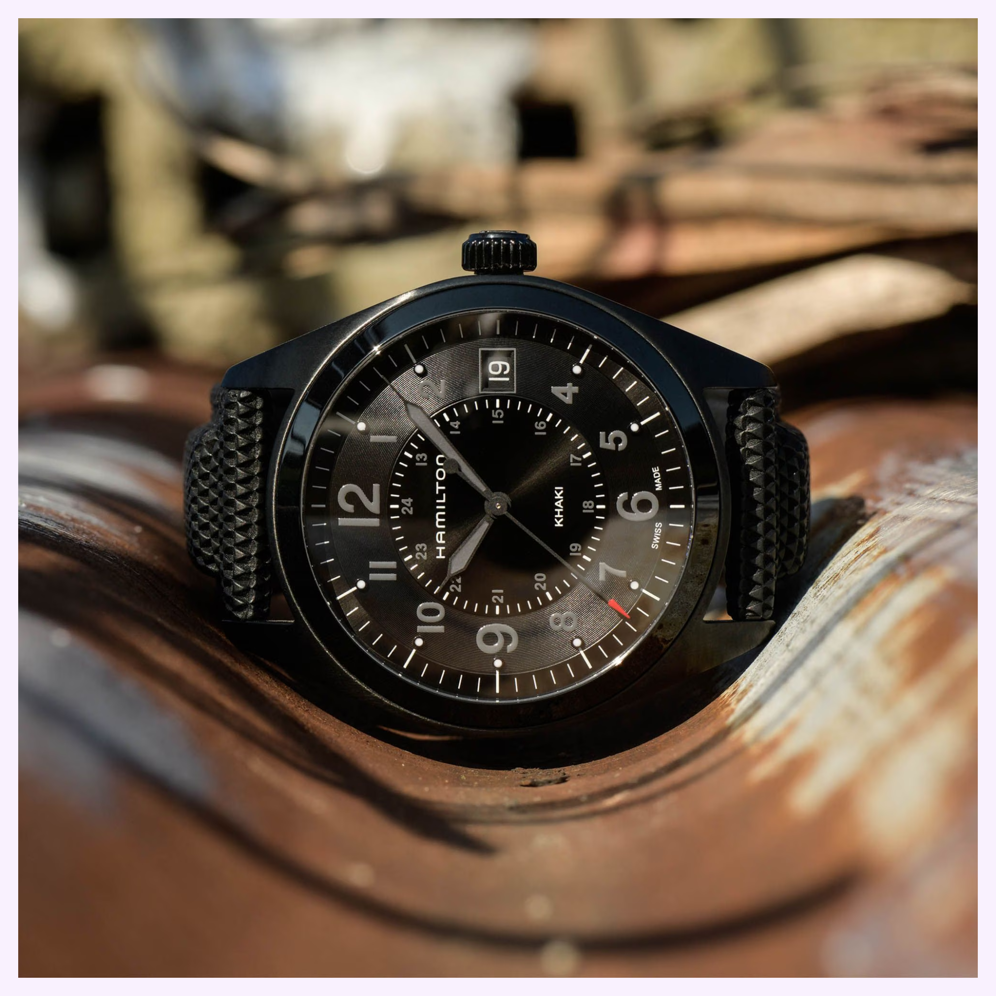 Hamilton H68401735 Khaki Field Quartz side profile showing black PVD stainless steel case and rubber-lined strap
