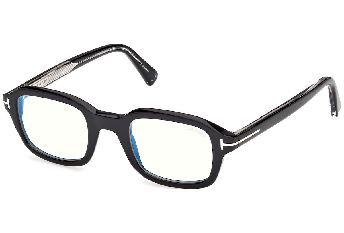 The Tom Ford ICON TI5013-B/V 005 eyewear features a black rectangular frame, clear lenses, and silver arm detailing—an ideal designer choice from Tom Ford Sunglasses, shown angled on a white background.