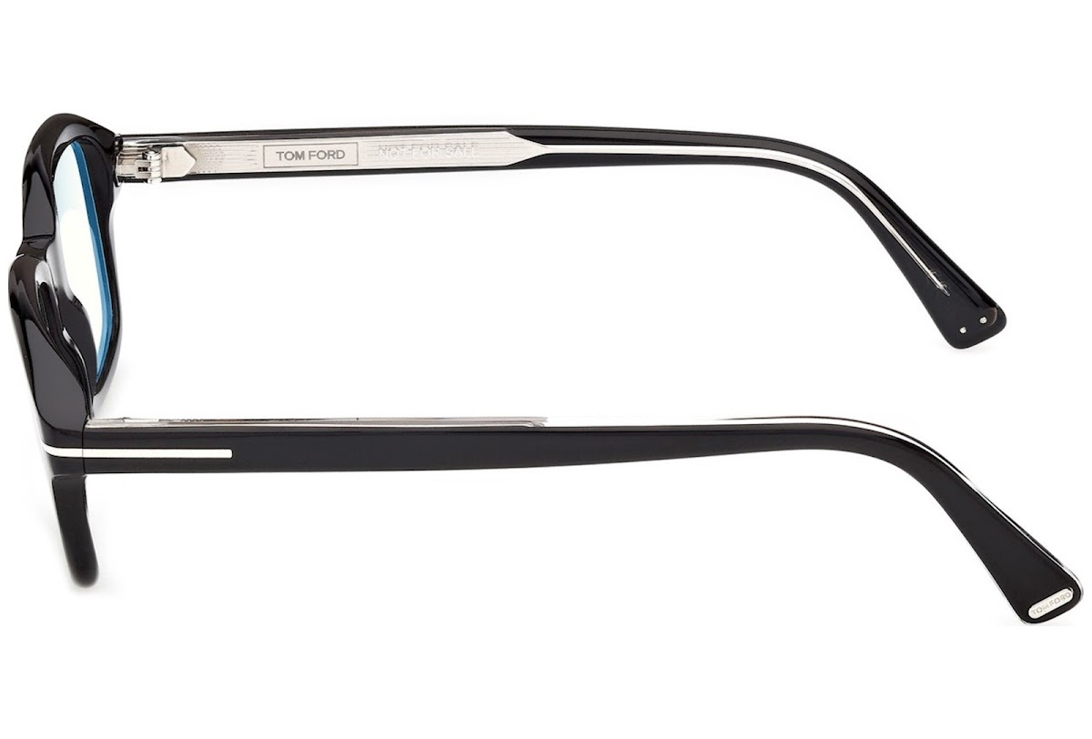 Side view of Tom Ford ICON TI5013-B/V 005 black frames with silver arm detailing and engraved TOM FORD logo on the inside left temple—a sophisticated designer pair by Tom Ford Sunglasses.