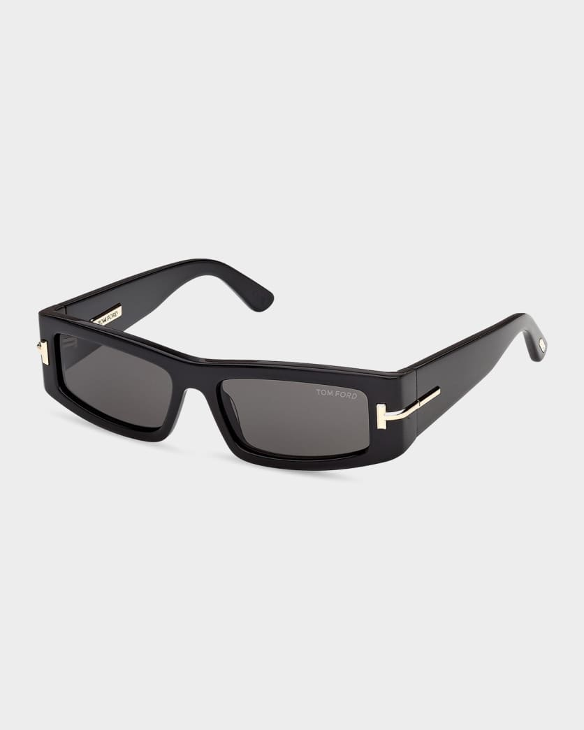 The Tom Ford ICON TI0026/S 01A sunglasses feature a black rectangular design with thick frames, dark tinted lenses, and gold temple detailing, showcasing luxury style by Tom Ford Sunglasses on a plain light background.