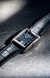 The Frederique Constant Classic Carre Automatic Leather FC-303N4C26 features a luxury rectangular case, blue textured dial with silver markers, and a black leather strap—epitomizing Frederique Constant’s timeless design.