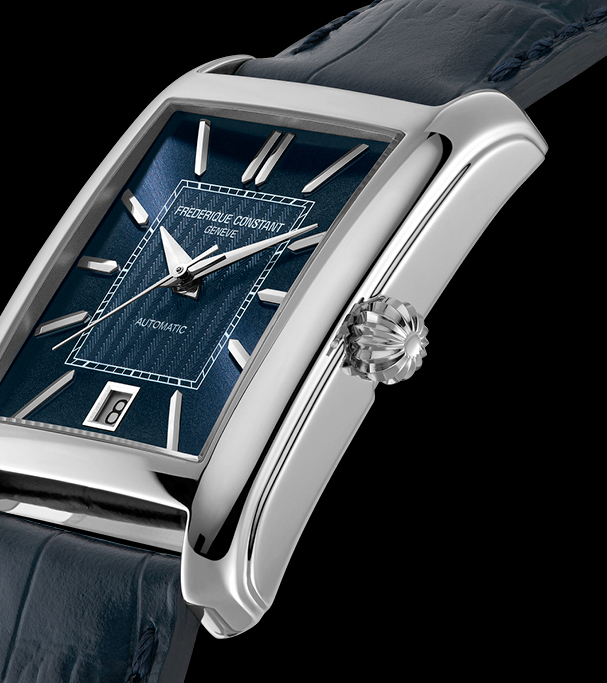 Close-up of the Frederique Constant Classics Carrée FC-303N4C26 blue embossed dial, silver hour markers, date window at 6 o'clock and grooved crown