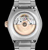 Close-up of the Frederique Constant Highlife Automatic COSC FC-303V4NH2B shows its transparent case back revealing the movement, stainless steel bracelet with engravings, rose gold crown, and globe-pattern dial for an elegant look.