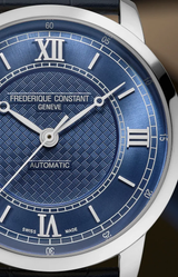 Close-up of a Frederique Constant Watches Classics Premiere FC-301N3B6 with blue dial, Roman numerals, textured face, silver hands, and visible Frederique Constant branding and Automatic text.