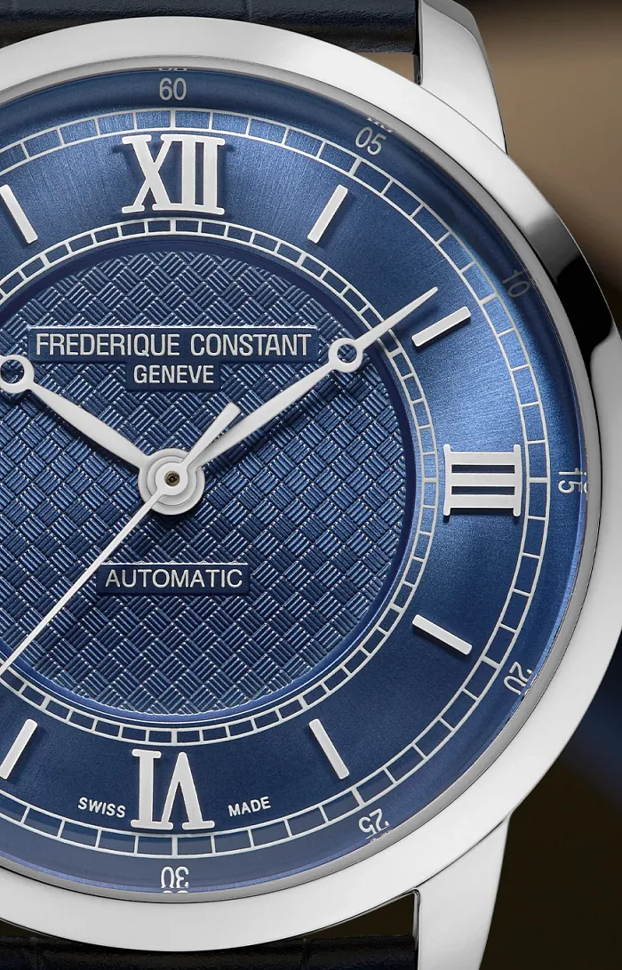 Close-up of Frederique Constant Classics Premiere FC-301N3B6 blue guilloche dial with Roman numeral hour ring and Arabic numeral minute track