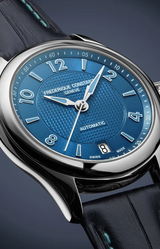 Close-up of the Frederique Constant Classics Runabout Automatic FC-303RMLN5B6 Limited Edition, featuring a blue textured dial with silver markers and hands, date at 6 o’clock, black leather strap. This Swiss made automatic watch is from Frederique Constant.