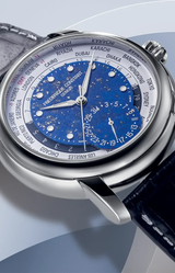 A close-up of the Frederique Constant Watches Manufacture Worldtimer Manufacture FC-718LA4H6, showcasing a blue starry Lapis Lazuli dial, silver case, world time city names around the edge, and a navy-blue leather strap.