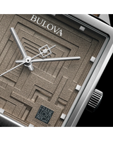 Close-up of the limited edition Bulova Watches 96A314 Ennis House men's watch, featuring a geometric textured square face, silver hands, and maze-like patterns inspired by architectural classics from the FRANK LLOYD WRIGHT COLLECTION.