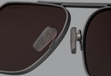 Close-up of the nose pads and polarized lenses on Dita Sunglasses DLS424-A-03 LSA-424, featuring a matte frame and dark lenses, set against a plain gray background.