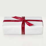 A rectangular white gift box wrapped with a red ribbon featuring the Cartier logo—perfect for gifting luxury eyewear like Cartier Sunglasses CT0550S-008 56.