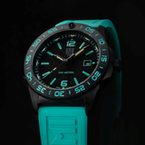Introducing the Luminox Watches Pacific Diver Limited Edition 44 mm XS.3124.N.SET by Luminox Watches—a Swiss Made dive watch presented against a black background. This limited edition timepiece features a black dial with blue luminous hour markers, a turquoise strap, date display, and boasts water resistance up to 200 meters.
