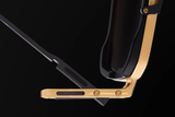 Close-up of gold and black hinges on the Dita Sunglasses HYPERLUX-1000 DTS470-A-02 against a black background, highlighting intricate details, screws, and DITA branding on the arm—an exquisite display of Japanese craftsmanship in luxury eyewear.
