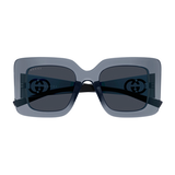 The Gucci Sunglasses GG2025S-003 49 feature a square, oversized design with dark lenses and slim black arms. Showcasing the iconic Gucci logo on both lenses, these luxury sunglasses are displayed on a plain white background.