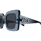 Close-up of Gucci Sunglasses GG2025S-003 49 with dark, square frames and black lenses. The temples display a bold silver Gucci GG logo, and the glossy finish highlights their luxury fashion style.