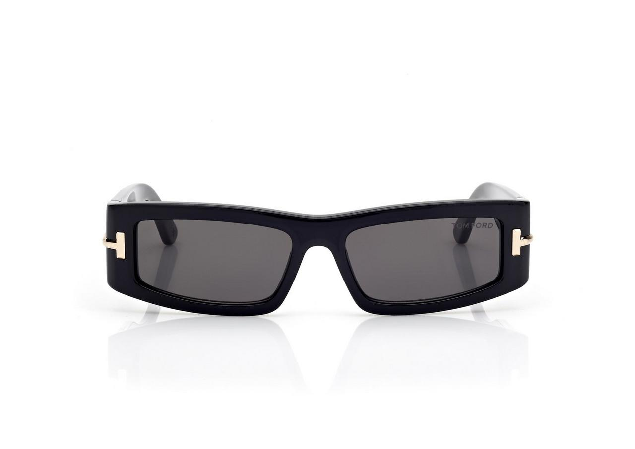 The Tom Ford ICON TI0026/S 01Z by Tom Ford Sunglasses features rectangular black luxury frames, dark lenses, and subtle gold accents on the sides, displayed against a white background.