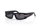 The Tom Ford ICON TI0026/S 01Z sunglasses feature a black rectangular frame, dark lenses, and gold hinge accents—luxury designer eyewear from Tom Ford Sunglasses displayed on a white background.