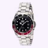 The Invicta Men’s 9403 Pro Diver Automatic 3 by Invicta Watches features a silver stainless steel band, a striking black and red bezel, black dial with silver hour markers, and a date display at the 3 o’clock position—all set against a light purple background. This automatic men’s wristwatch captures the essence of classic dive watch design.