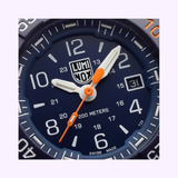 Luminox Navy SEAL Foundation 45mm Swiss quartz dive watch XS.3253.CBNSF.SET worn on wrist, blue IP stainless steel case
