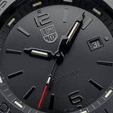 Close-up of a Luminox Watches Pacific Diver XS.3121.BO.1 watch face in black, showing the time as 1:16:18, with a date window indicating 31 and markings for 200-meter water resistance on this Swiss Made dive watch by Luminox Watches.