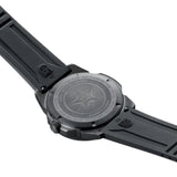 A close-up of the back of a black Luminox Watches Pacific Diver XS.3121.BO.1 wristwatch, UPC 7611382668004, with a star design and engraved text, attached to a black rubber strap—its robust and tactical construction reminiscent of a Swiss Made dive watch.